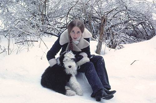 Lynn holding Farley on a snowy day